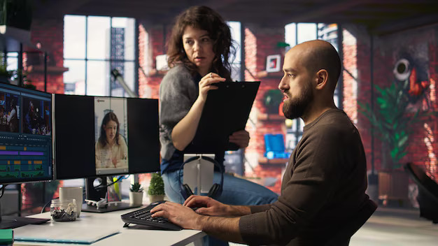 u4083-team-discusses-content-strategy-trends-while-reviewing-footage-computers_482257-125979