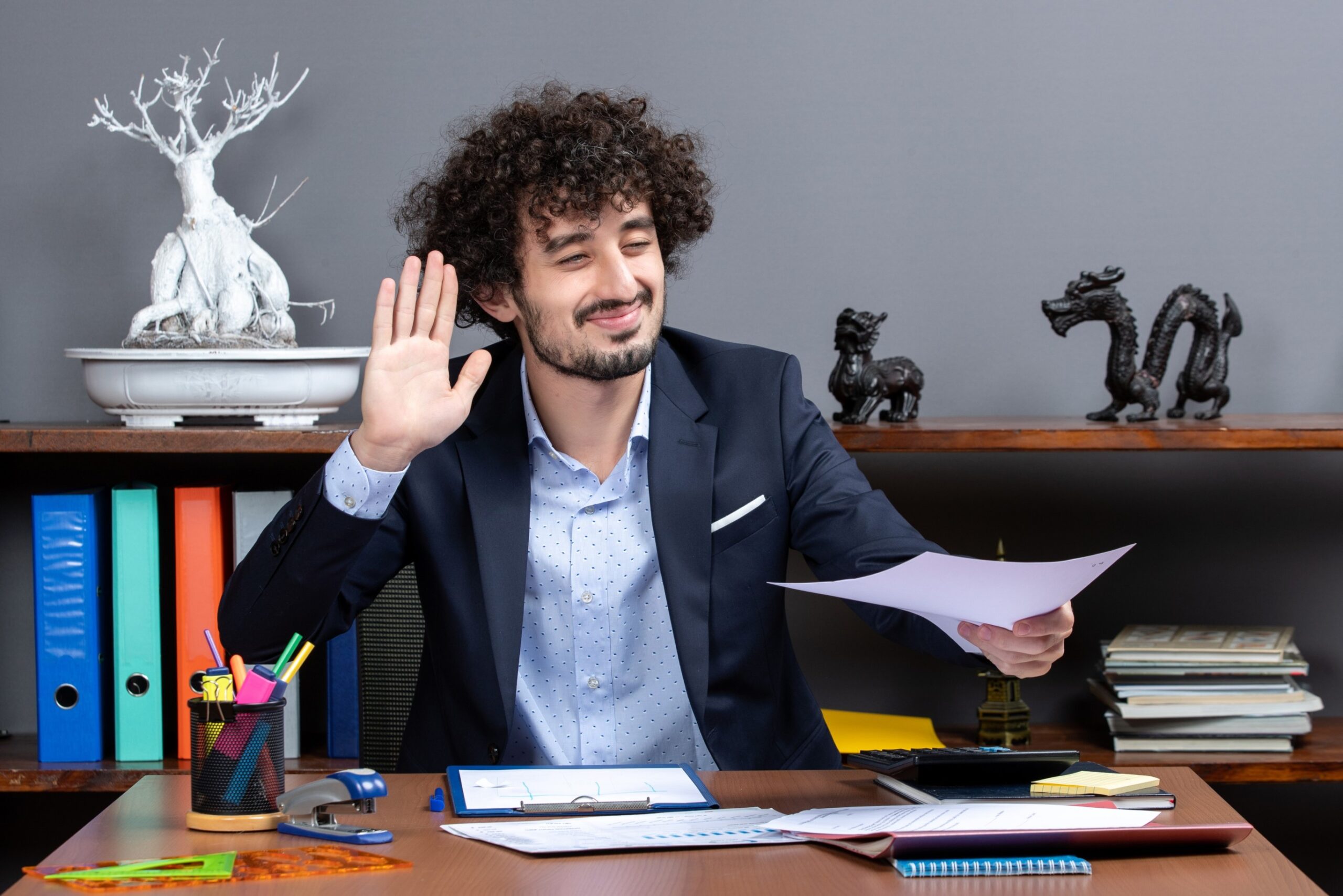 front-view-glad-businessman-hailing-someone-his-office-1-1